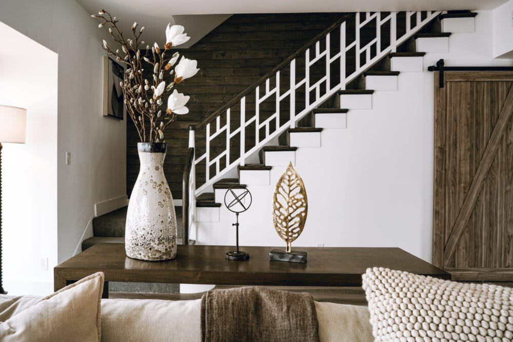 Arballo collection living room decor with decorative stair in background