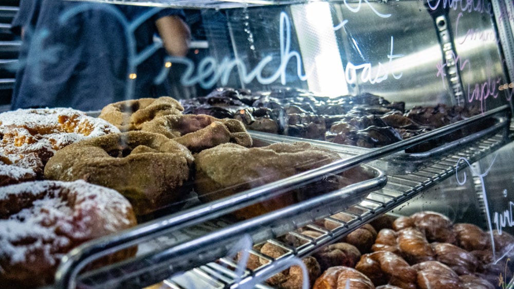 pastry cabinet with donuts and "French Toast" written on window