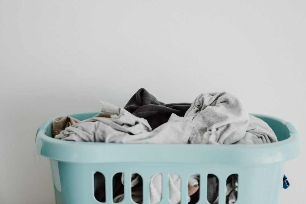 Laundry basket filled with clothes