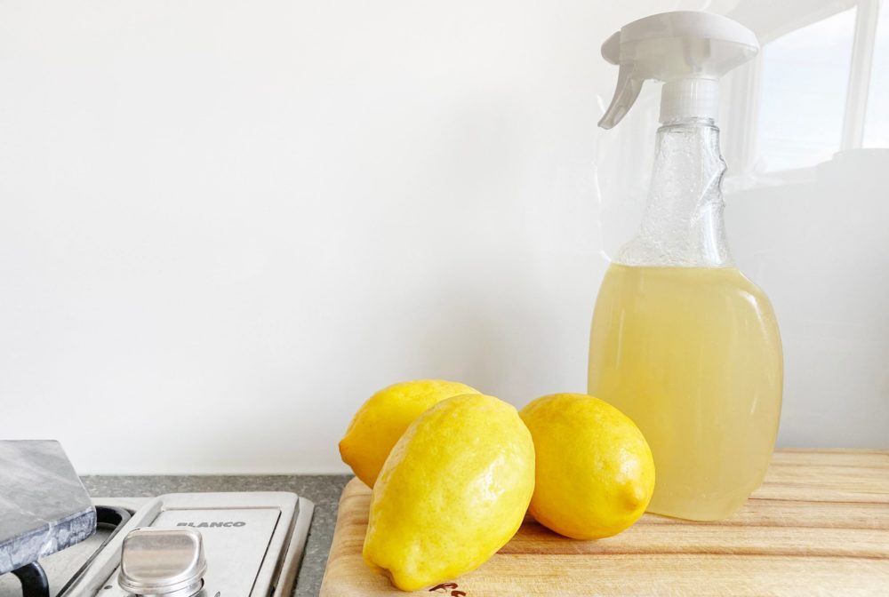 Kitchen counter with lemons and spray cleaner
