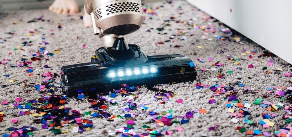 vacuum on rug with confetti